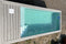 Piscina tipo contenedor de 6 metros (20 pies), color gris antracita, con función de natación a chorro.