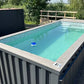 Piscina tipo contenedor de 6 metros (20 pies), color gris antracita, con función de natación a chorro.